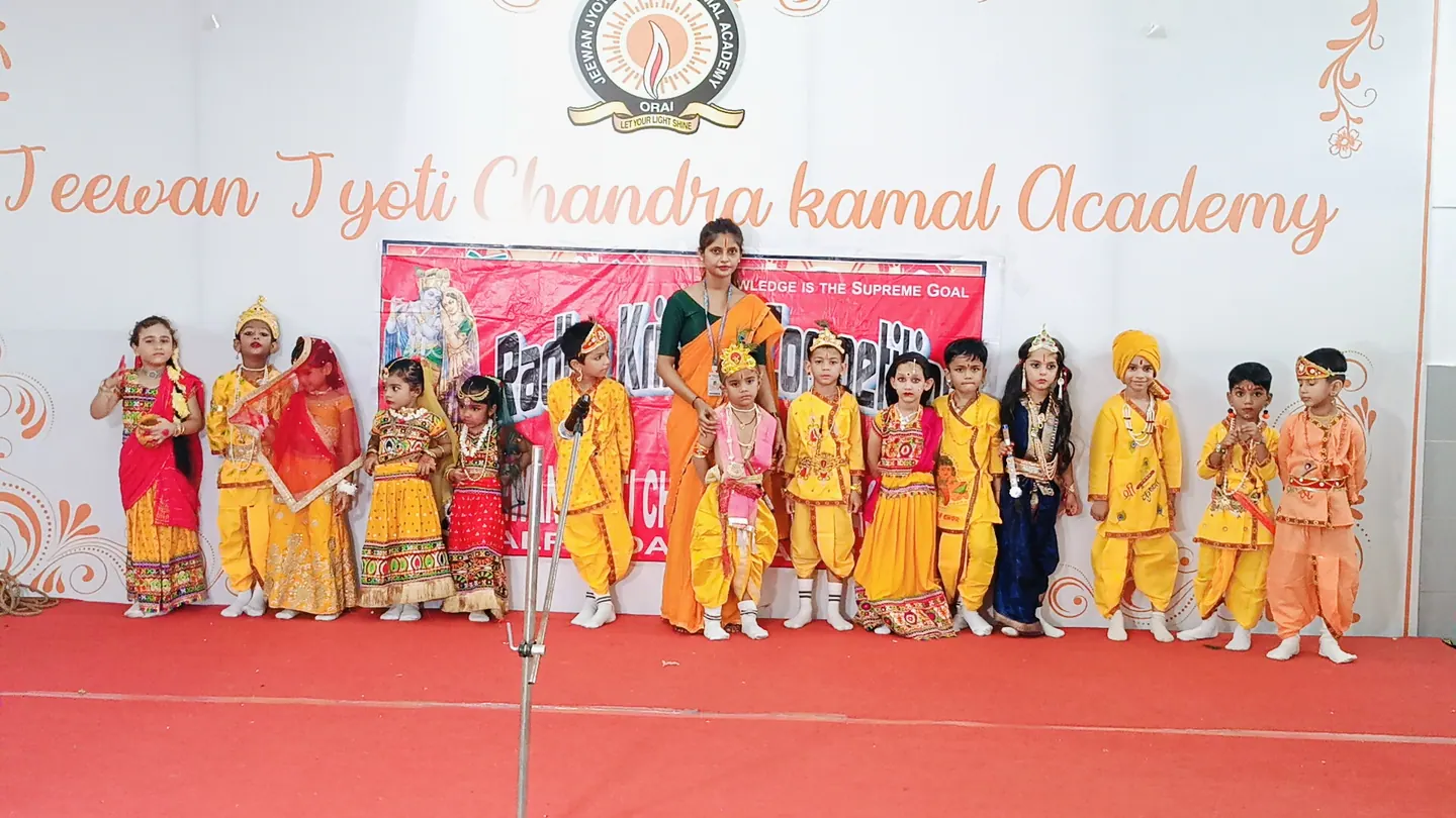 Children and their teacher at a school celebration.